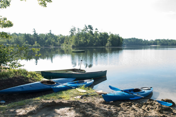 2 kayaks and row boat